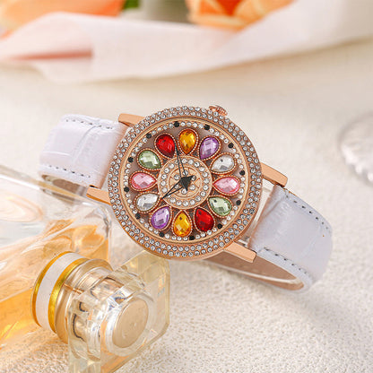 Montre à cadran rotatif pour femme avec diamants simulés colorés
